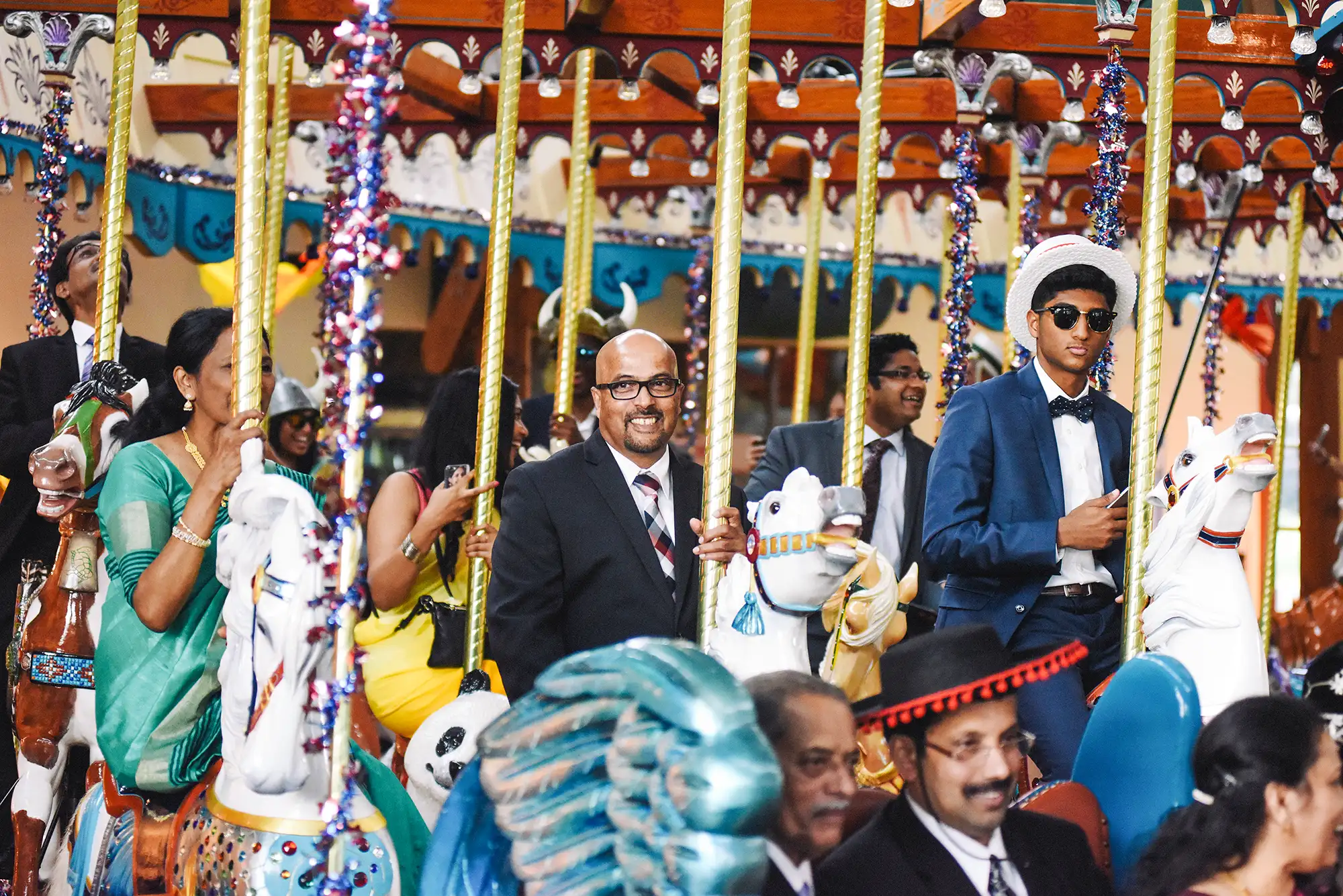 Wedding Party guests on the carousel